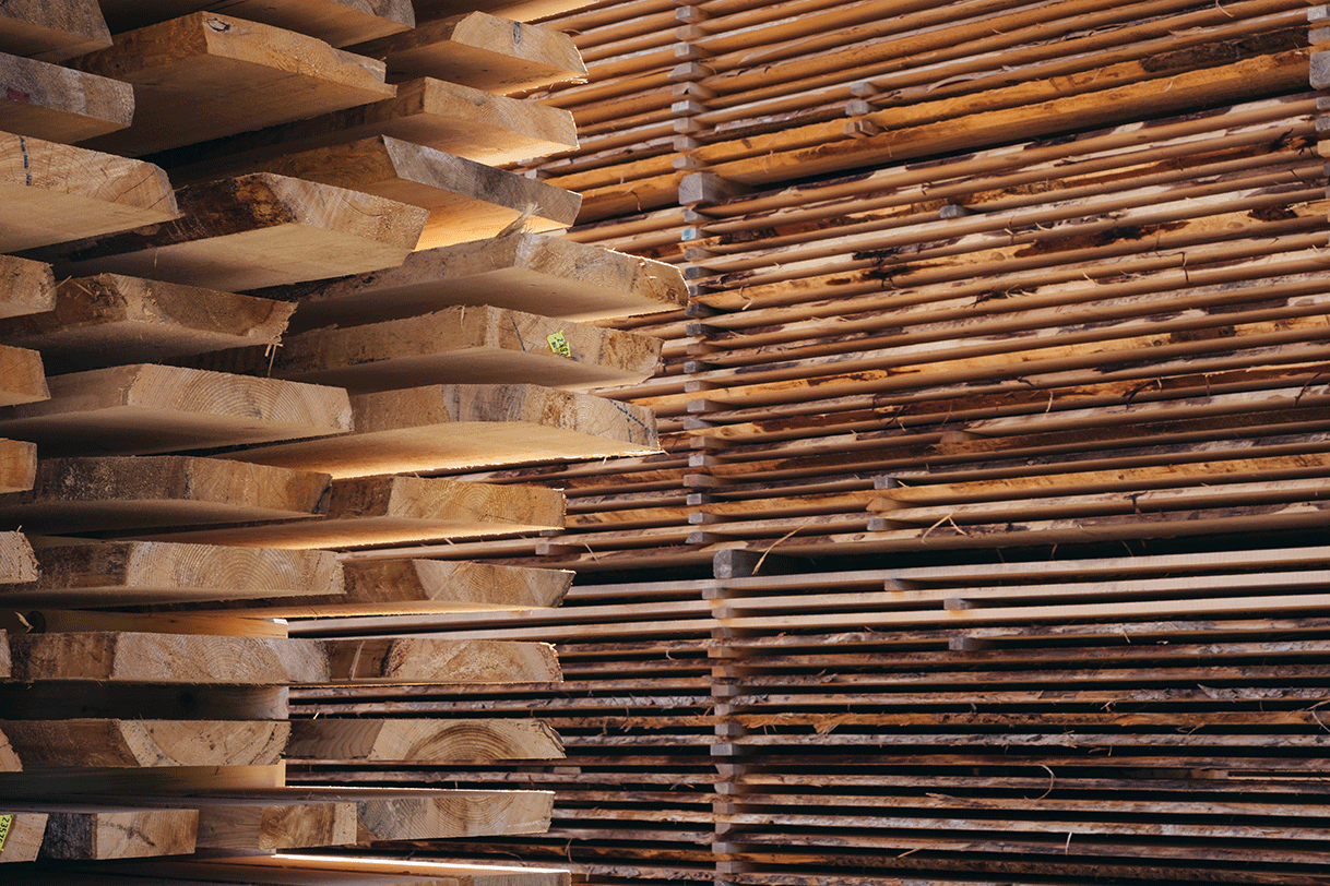 Stacked of boards stored in a lumber yard